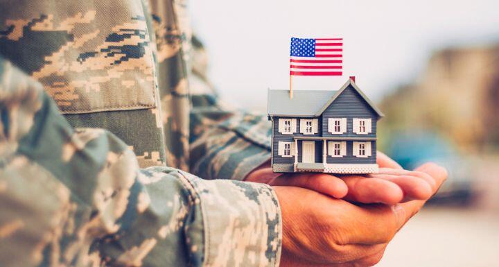 American Military Soldier holding house
