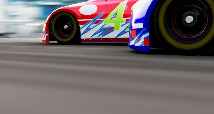 American stock cars racing in motion on racetrack 
