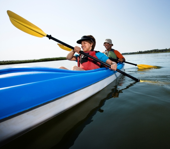 Couple Kayaking on Smooth Waters