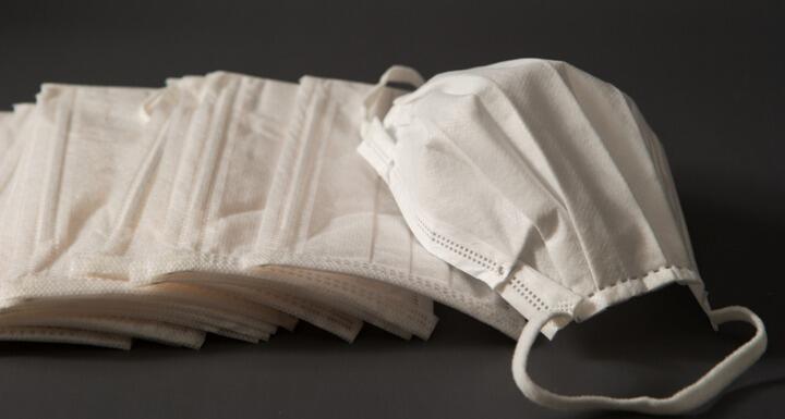 Medical masks on dark background