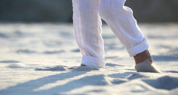 Person in white pants at the beach