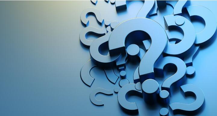 Blue cut outs of question marks arranged in an artful pile