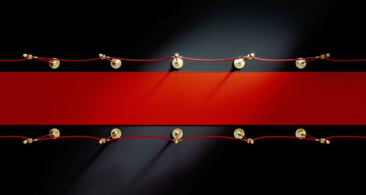 Red carpet over black background. 