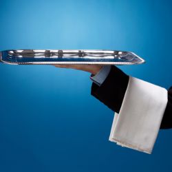 A waiter holding a tray