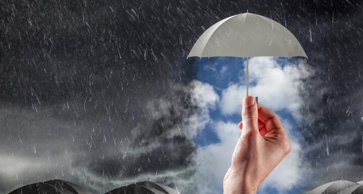 Umbrella over clear skies