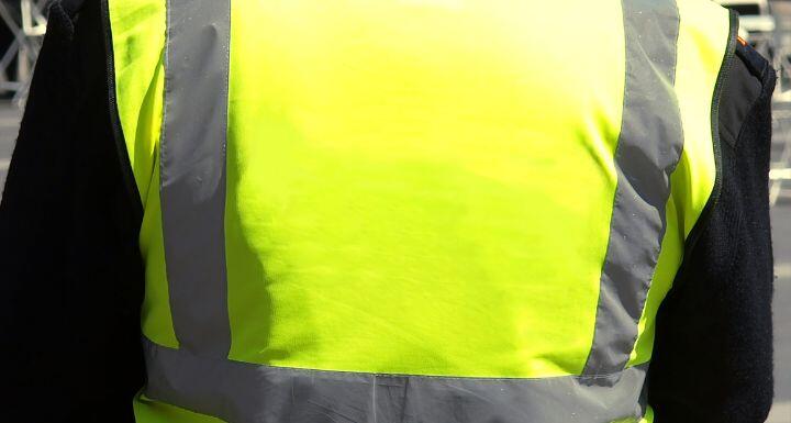 Unrecognisable yellow vest person